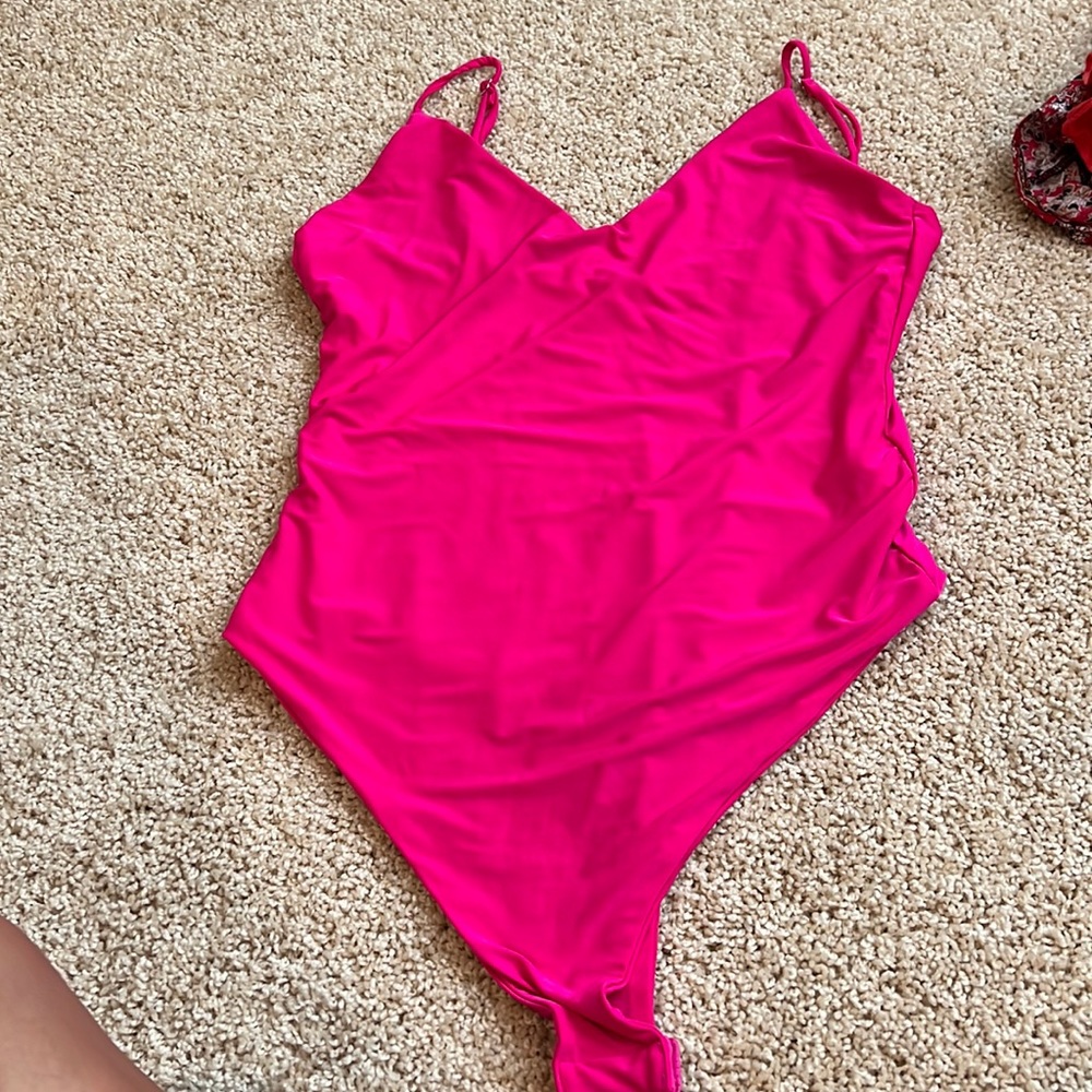 Hot pink body suit